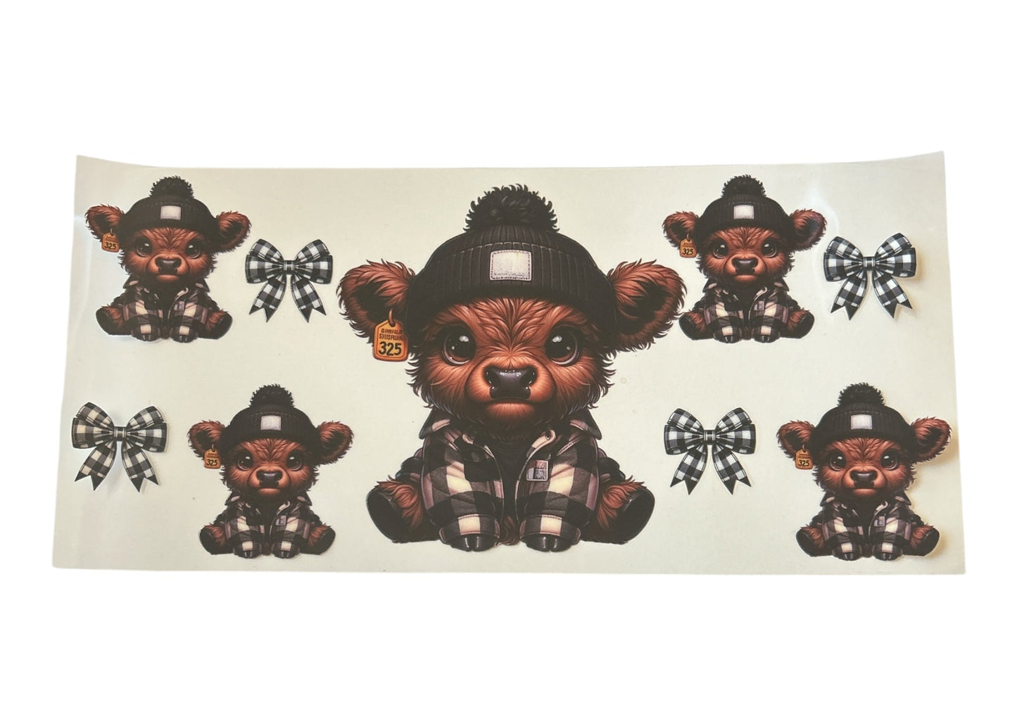 Sticker sheet with a cute highland cow design and checkered bows on a clear background