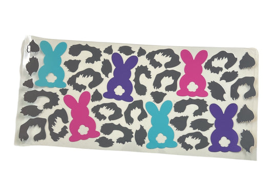 Cup wrap with colorful bunny designs on a leopard print background