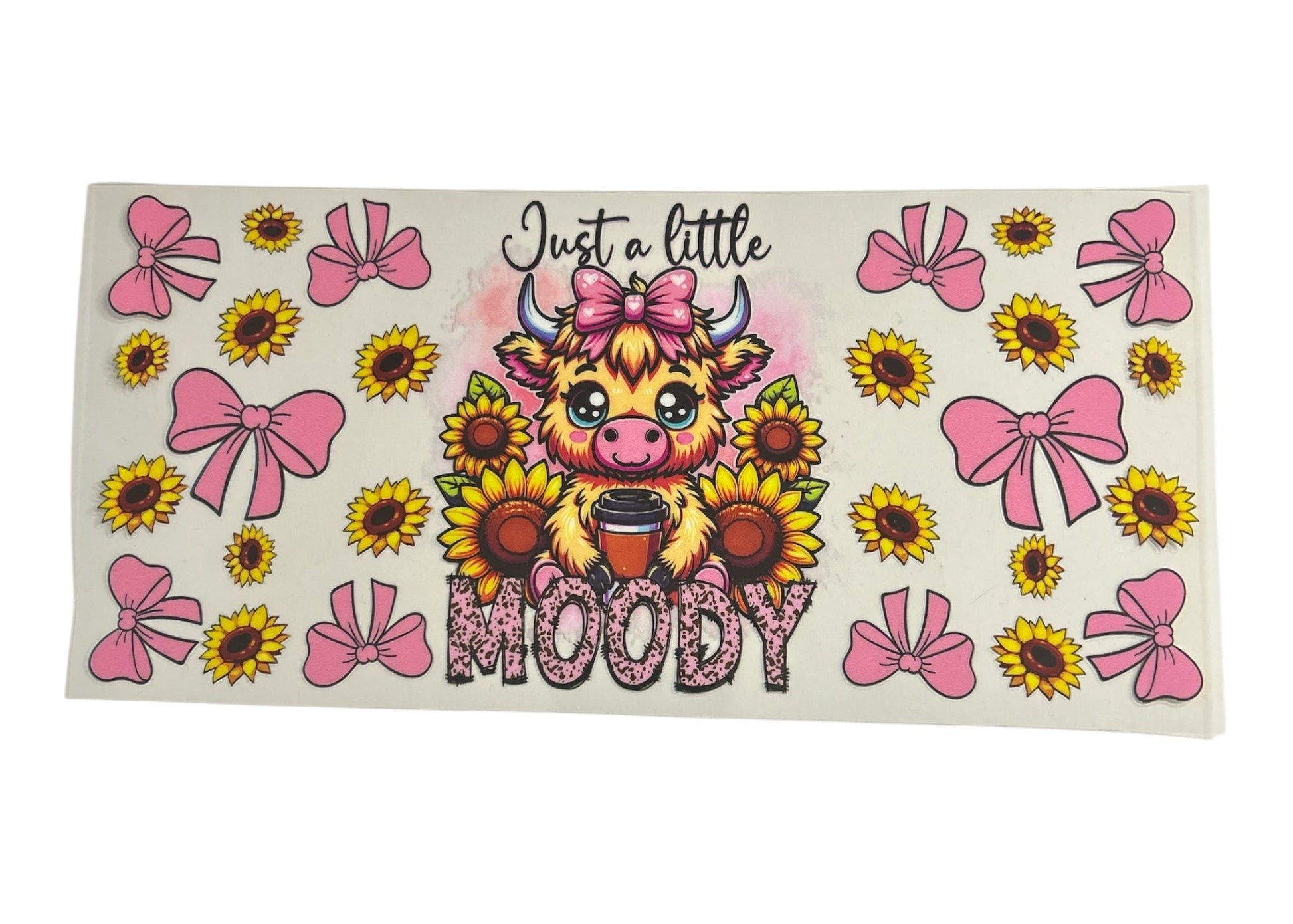 Sticker with a cartoon cow, sunflowers, and pink bows on a white background
