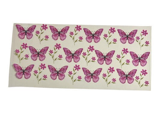Sheet of pink butterfly and flower stickers on a white background