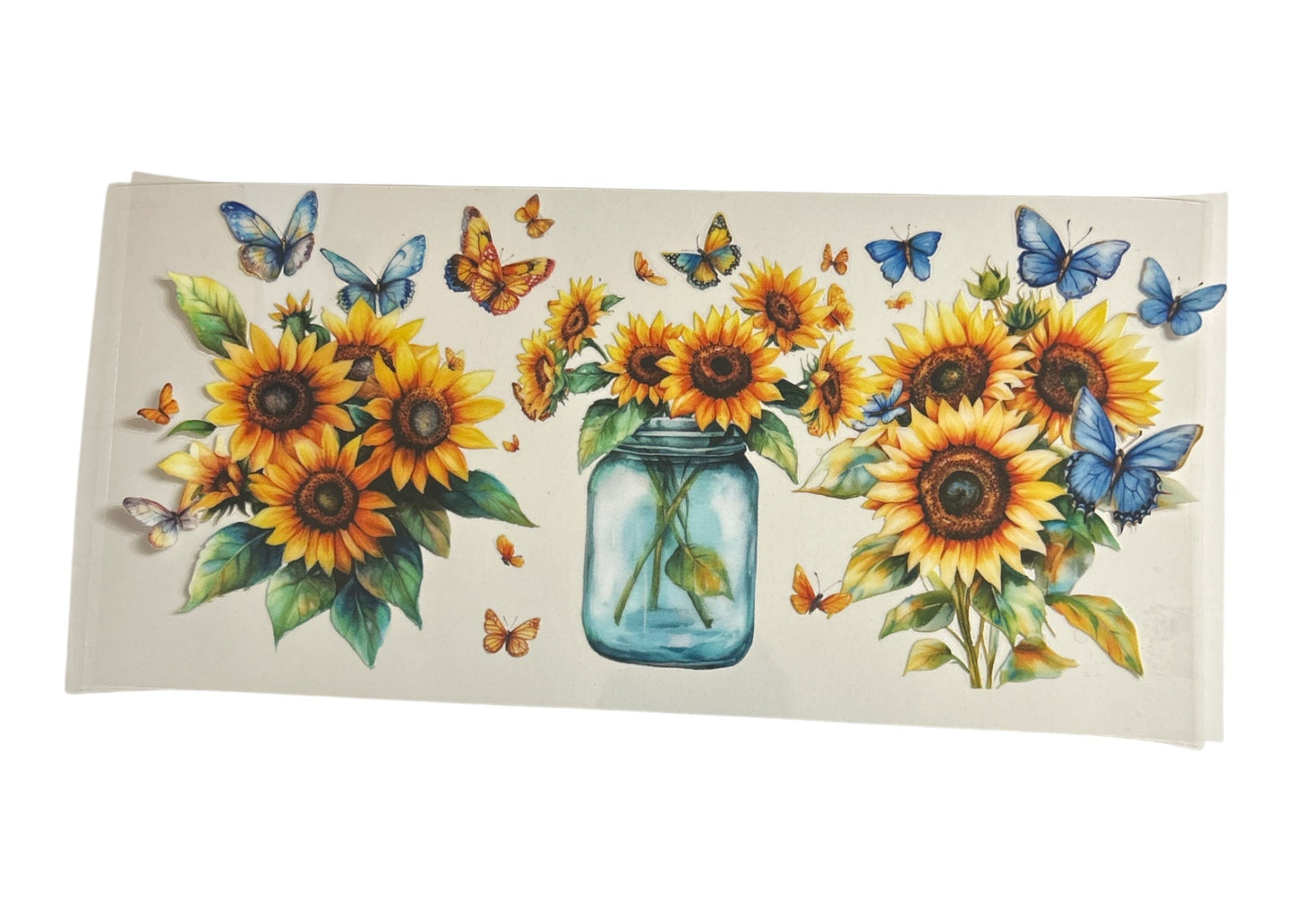Decorative cup wrap with sunflowers, butterflies, and a jar design on a clear background