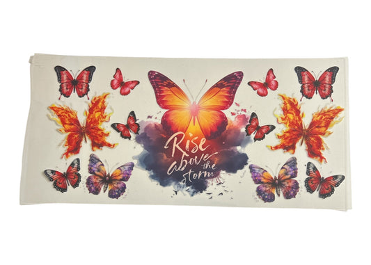 Cup wrap with colorful butterfly designs and 'Rise above the storm' text on a white background