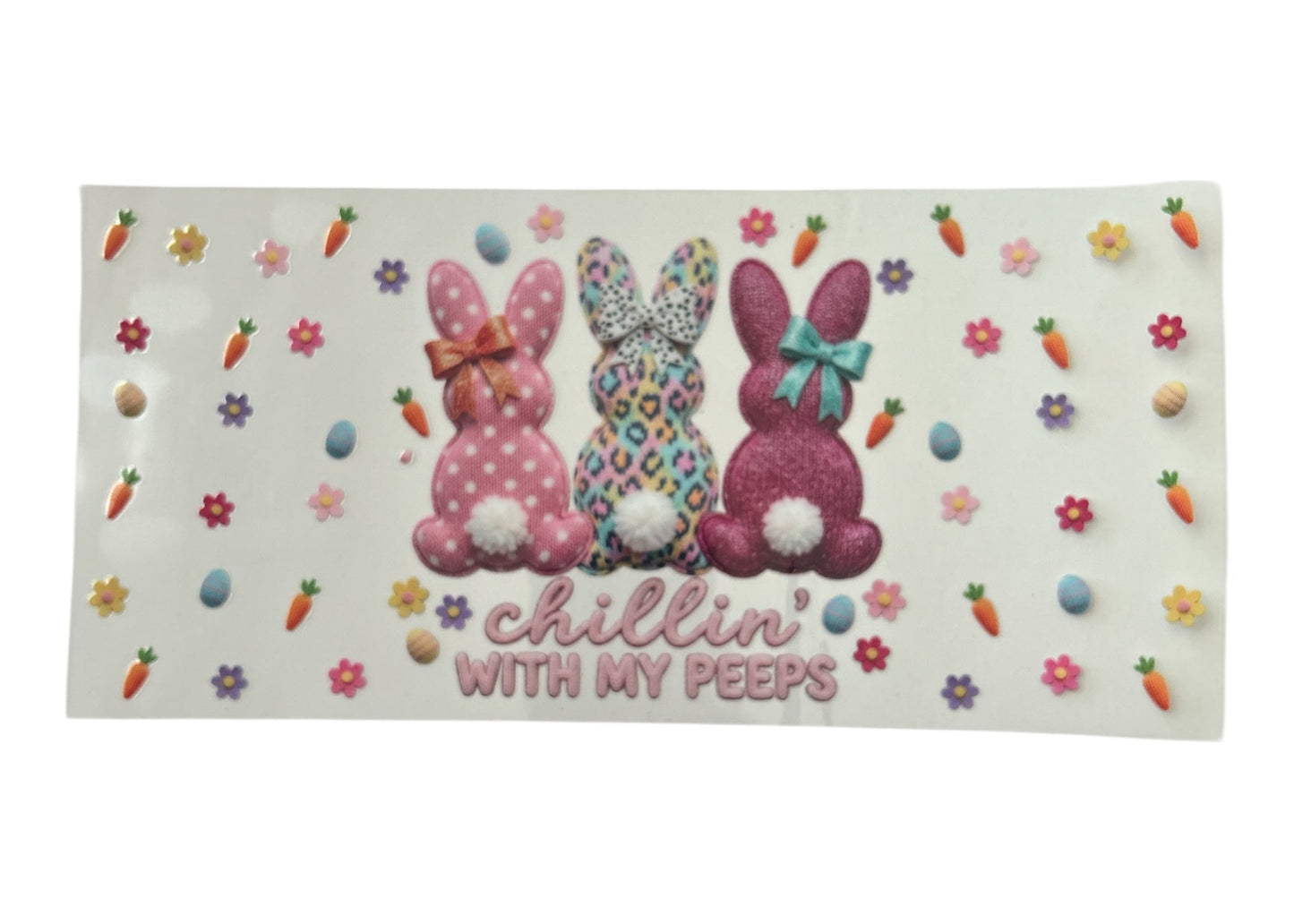 Three decorative bunnies with polka dots on a white background with Easter elements.