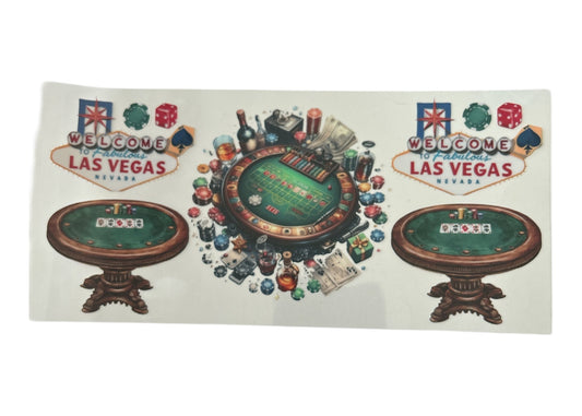 Decorative cup wrap with casino-themed design featuring roulette, cards, and Las Vegas signs.