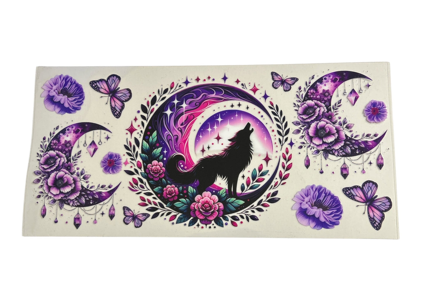 Decorative sticker with a wolf, moon, and floral design on a white background