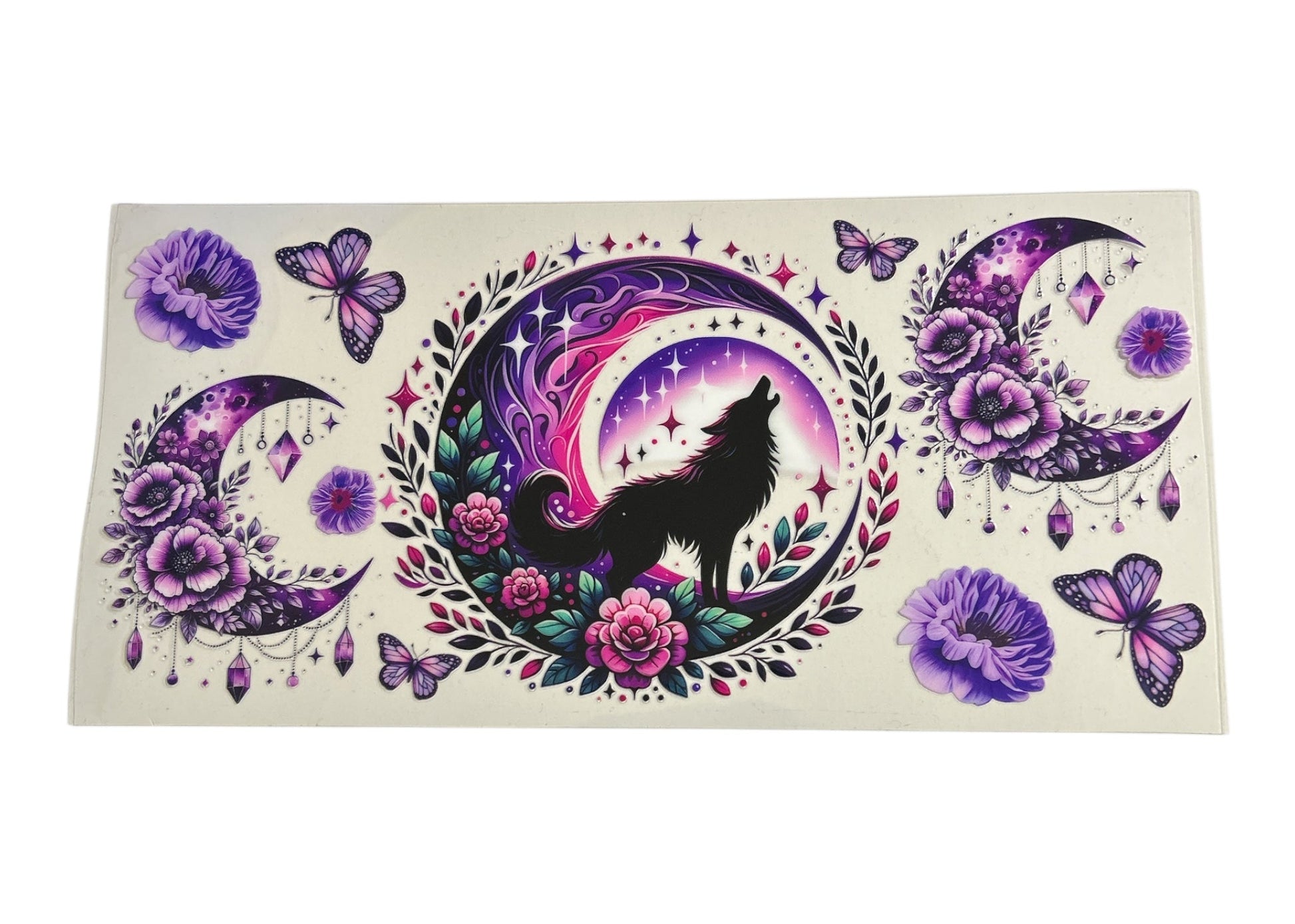Decorative sticker with a wolf, moon, and floral design on a white background