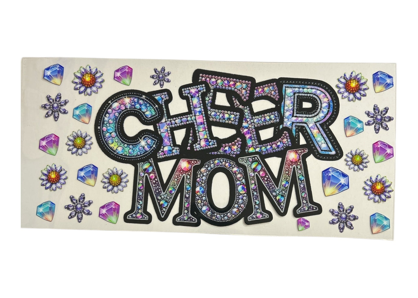 Glamorous cup wrap design featuring the words "CHEER MOM" in a shimmering faux-rhinestone texture, surrounded by various colorful 3D-effect gemstones and purple daisies.